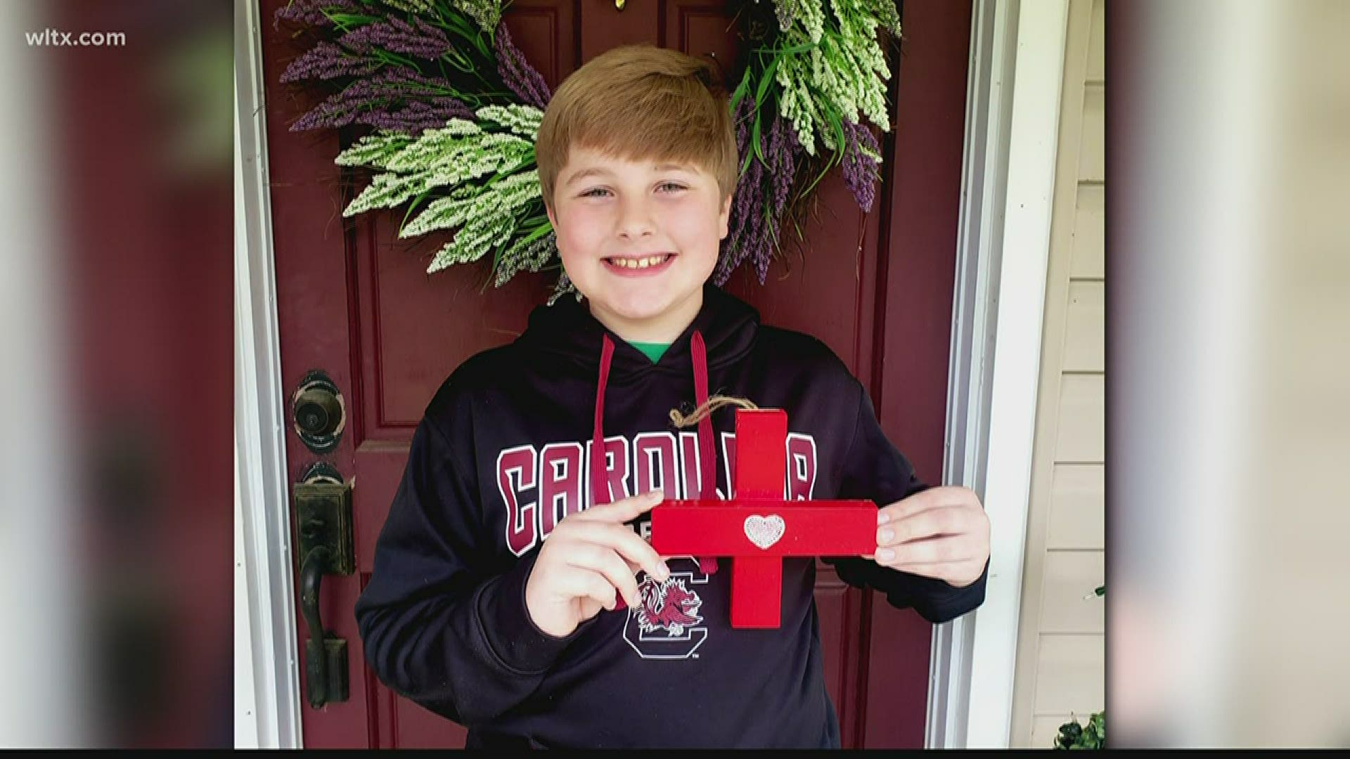 A Midlands 5th-grader is making red wooden crosses to support healthcare workers and first responders.