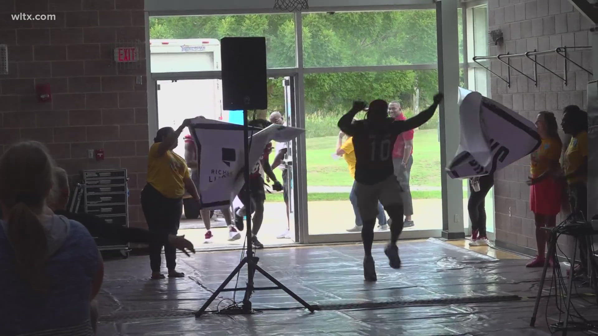 Members of the USC football team encourage kids to read during the annual "Pigskin Poets" event. Dante Reno and Mazeo Bennett took time to preview the 2024 season.