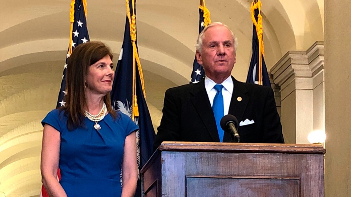 South Carolina Gov. Henry McMaster puts on a Carolina Panthers hat as he  speaks during a ceremony in Rock Hill, S.C., Wednesday, June 5, 2019. The  Panthers are planning on building a