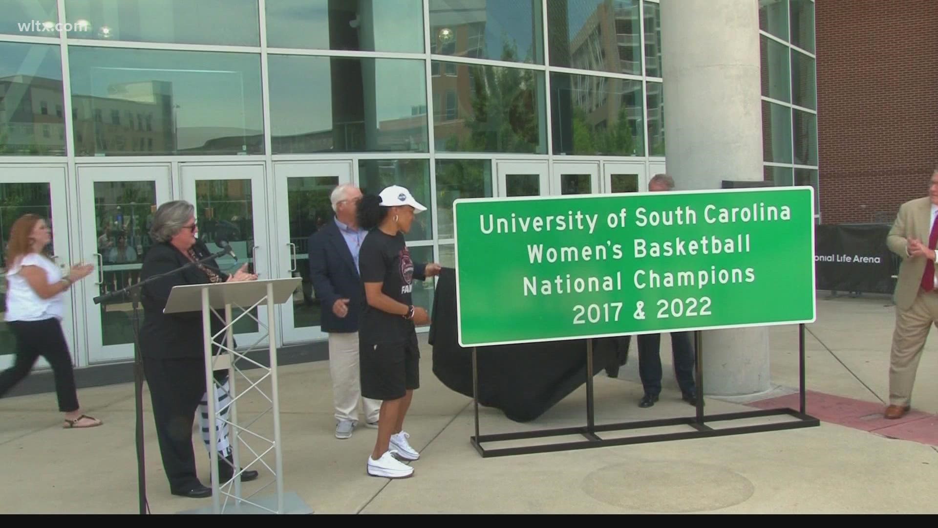 The first highway sign to celebrate the 2017 and 2022 national championships for women's basketball was unveiled Thursday.