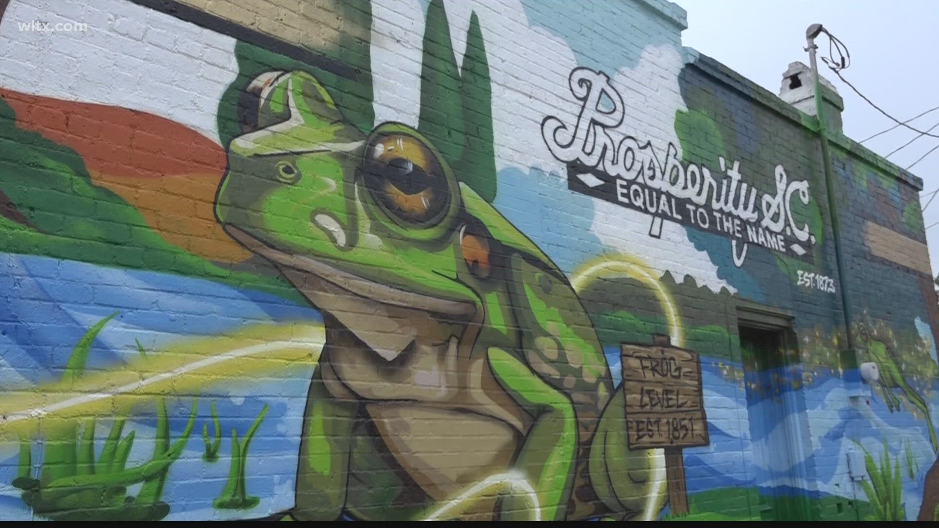 A new mural in downtown Prosperity is bringing life back in the form of spray painted frogs.