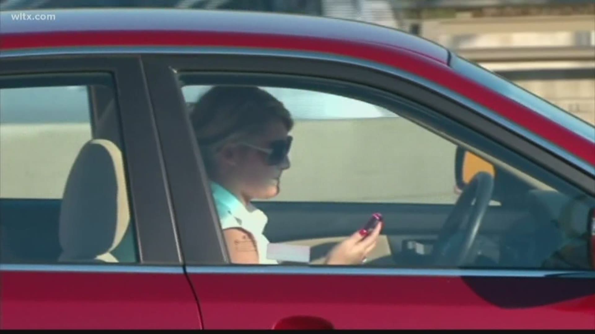 The bill would ban drivers from holding or using a wireless device without an earpiece or Bluetooth