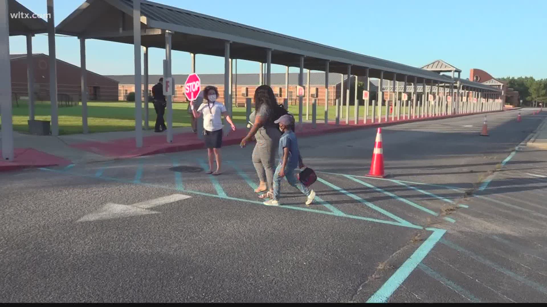 Students taking part in the district's hybrid plan were dropped off at school this morning.