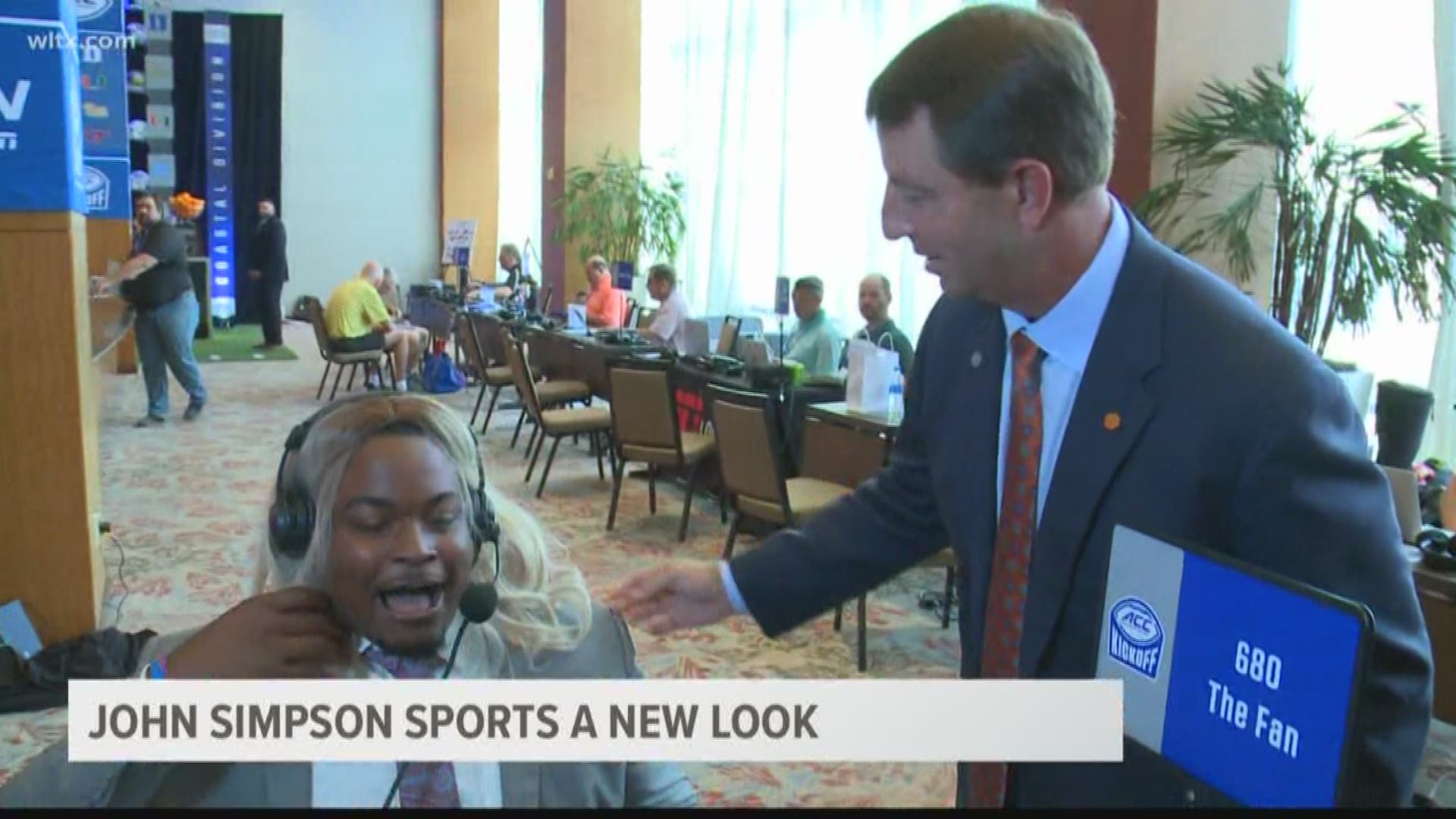 Clemson offensive lineman John Simpson has some fun at ACC Kickoff as he uses a blonde wig to take on a new persona.