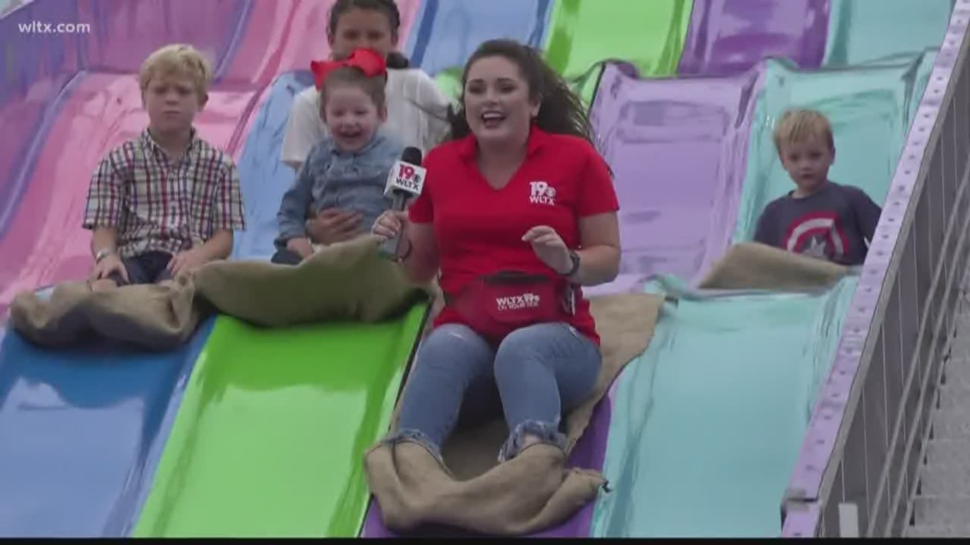 Emily Correll got into a fun slide race with a few kids at the South Carolina State Fair.