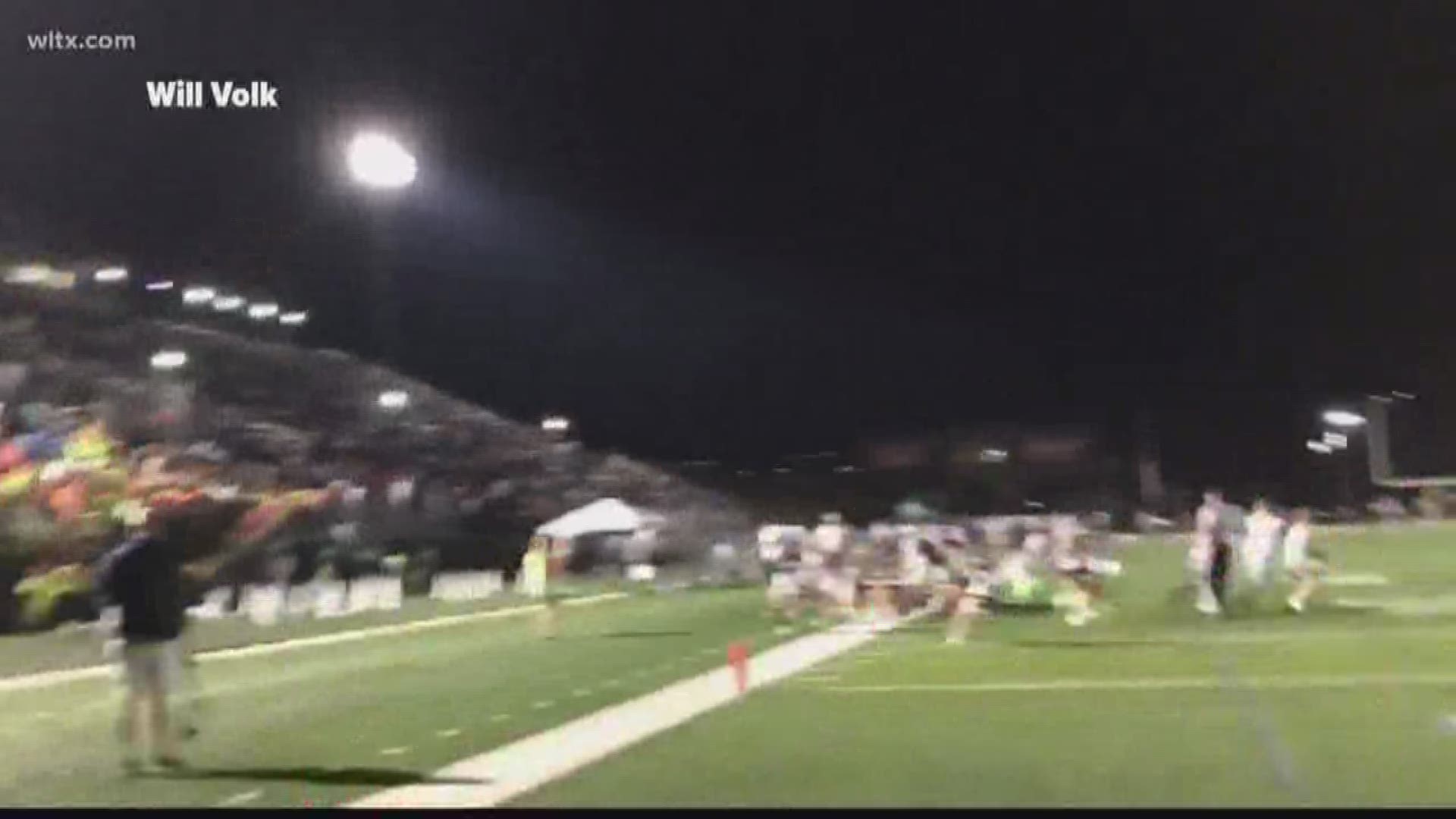 A panic at Dutch Fork stadium led to the suspension of the game.  