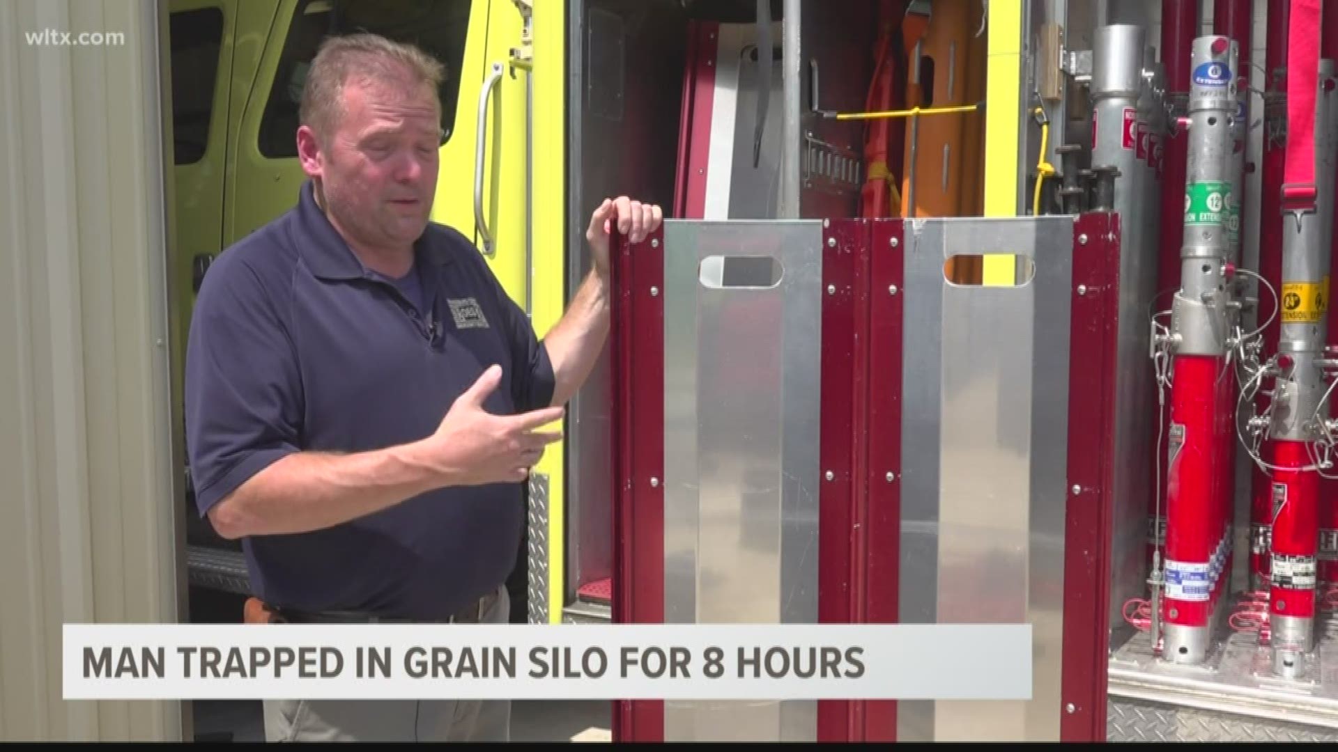 The fire department has panels that fit into a grain bin that will help to keep the grain off the person trapped inside.