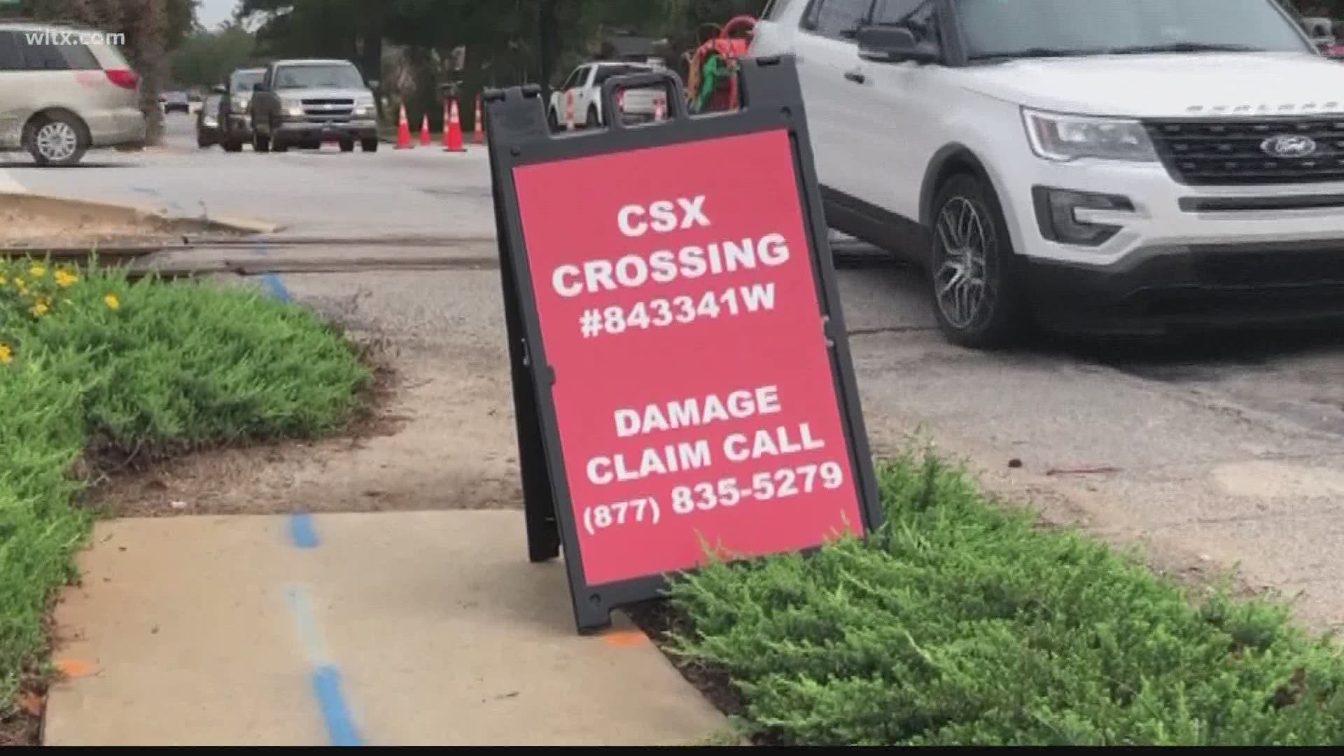 Residents of Irmo are putting out a sign to get CSX to help fix their railroad crossing.