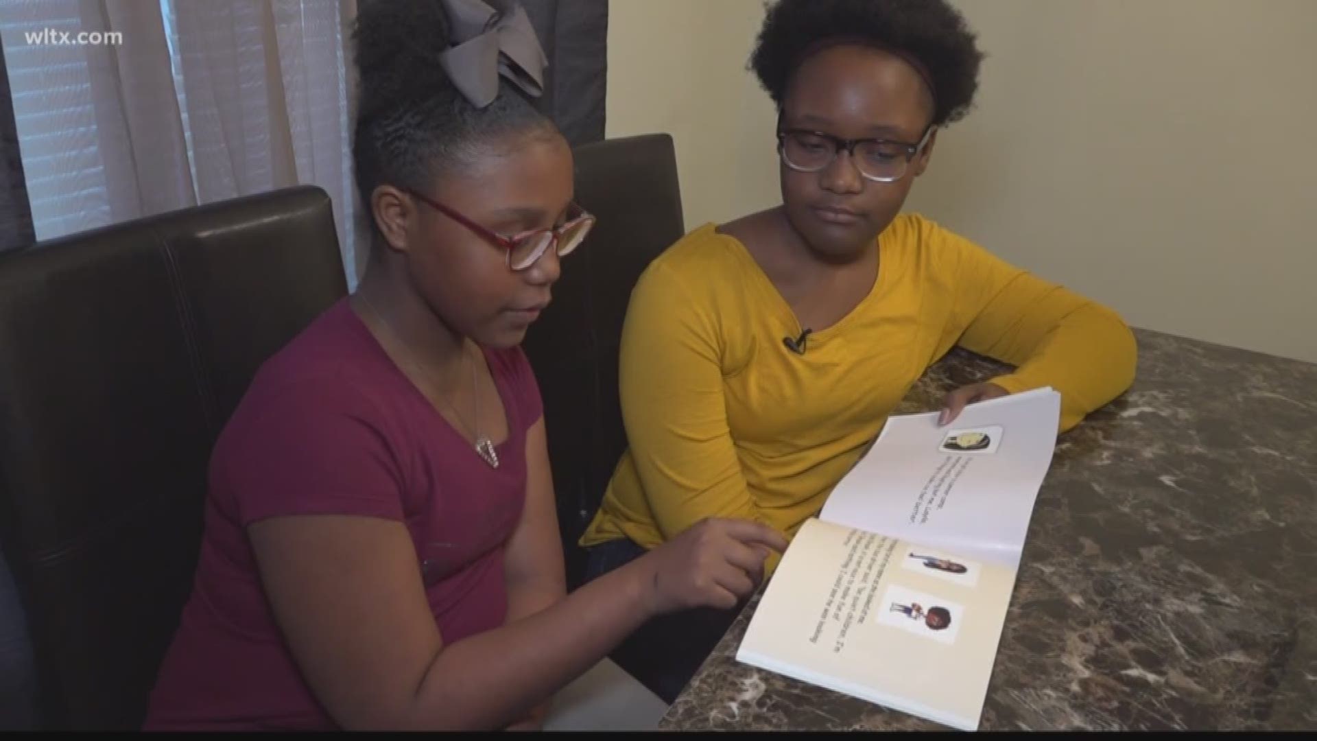 Two sisters have created a book to help other kids with bullying