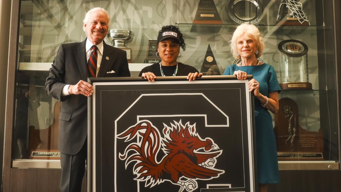Dawn Staley presented with Gamecocks flag that flew over capitol | wltx.com