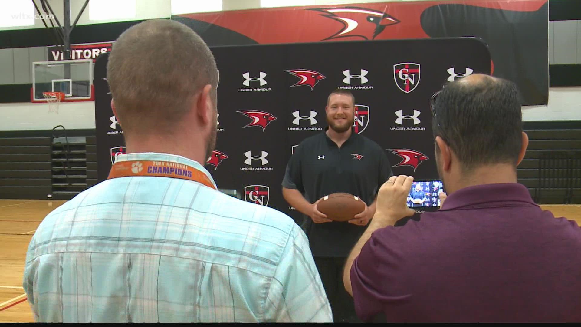 Former South Carolina offensive lineman Cory Helms is the new head football coach at Cardinal Newman.