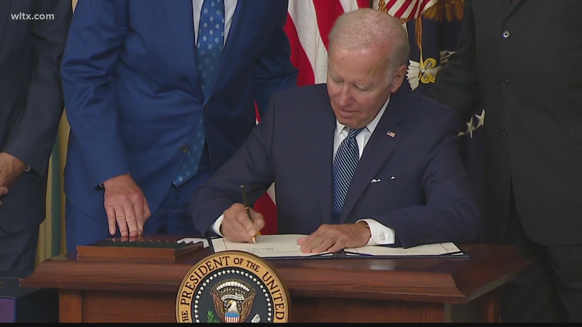 President Biden signed the Inflation Reduction Act into law at the White House on Tuesday.