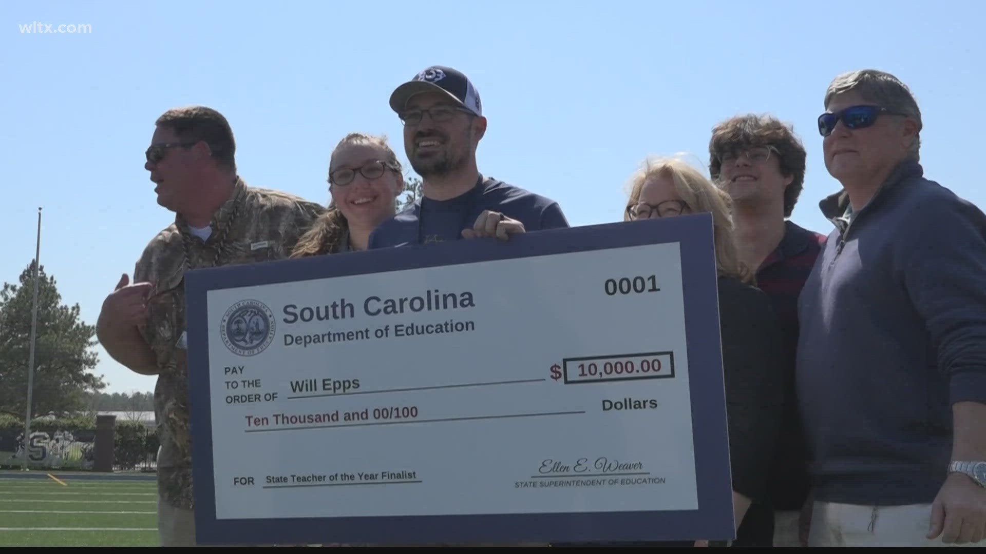 High school teacher Will Epps was surprised with the news and a check for $10K.