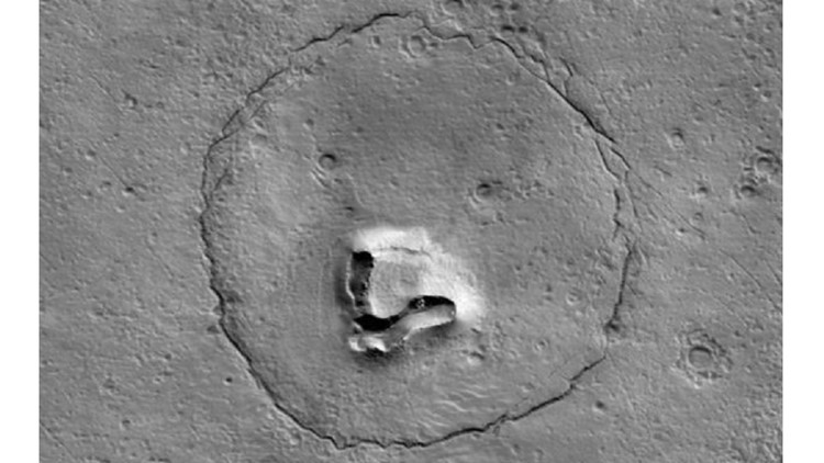 Mars craters and cracks create image of a 