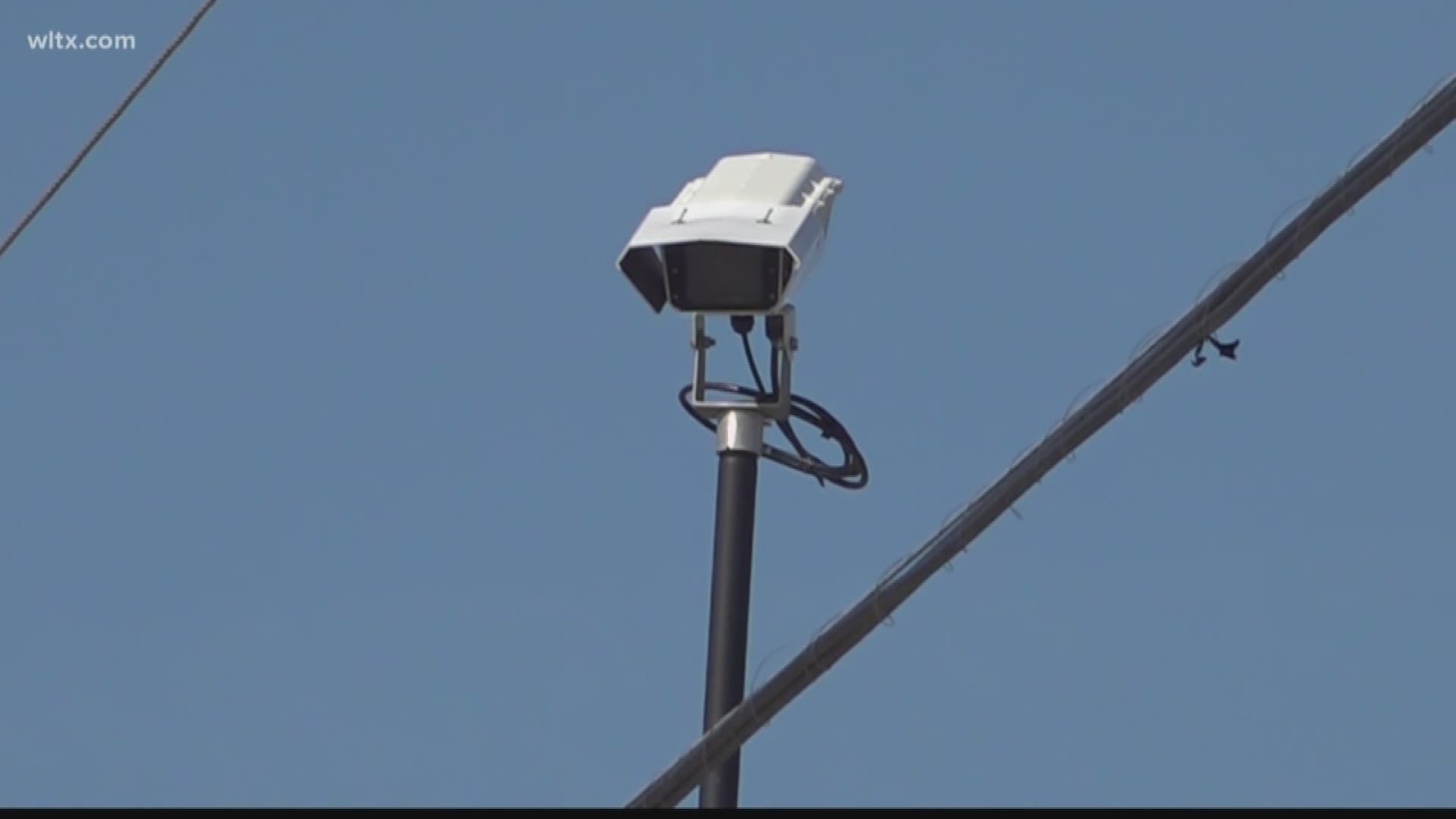The town installed cameras around various intersections to monitor the traffic and update traffic signals as it sees fit.  Although it's been around for almost two years, the town is expanding the system and starting phase two soon.
