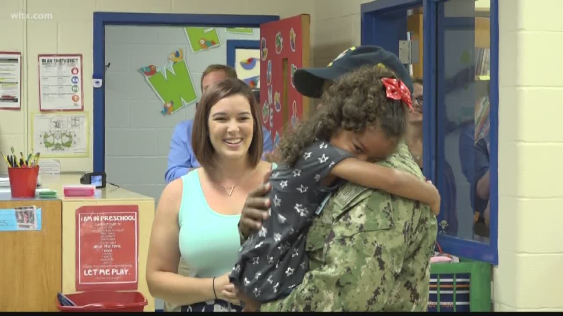 A military parent returning home from a long deployment to surprise their unsuspecting child in school.
