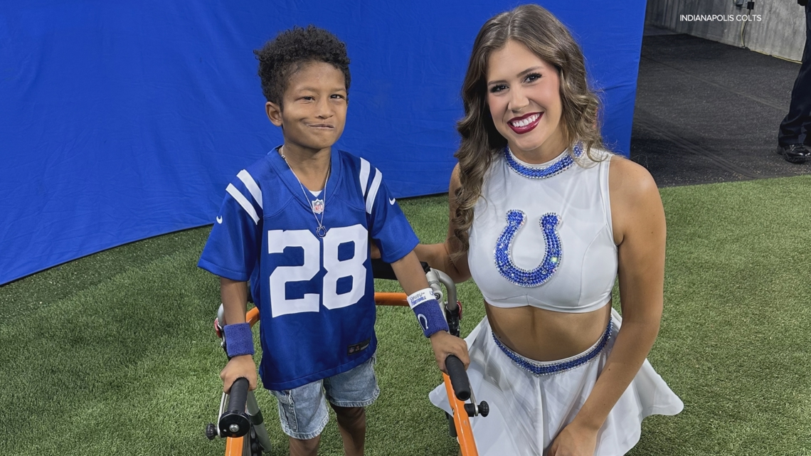 Indianapolis Colts cheerleader Morgan McLain uses sign language to connect with deaf fan at Lucas Oil Stadium
