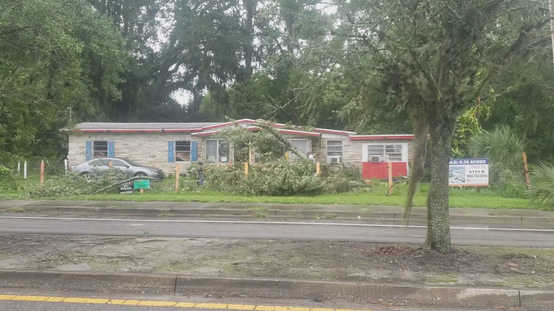 Emergency crews in Jacksonville are responding to downed trees and powerlines in the area of Spring Park Road.
Credit: Dawn White