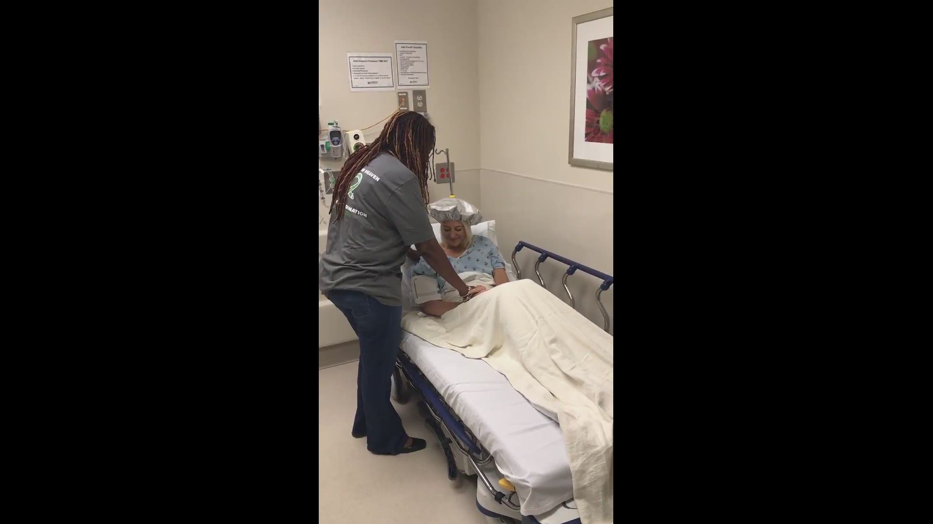 Dante Sipp's kidney donor, Lauren Larrison, prays with Dante's family before she heads into surgery.