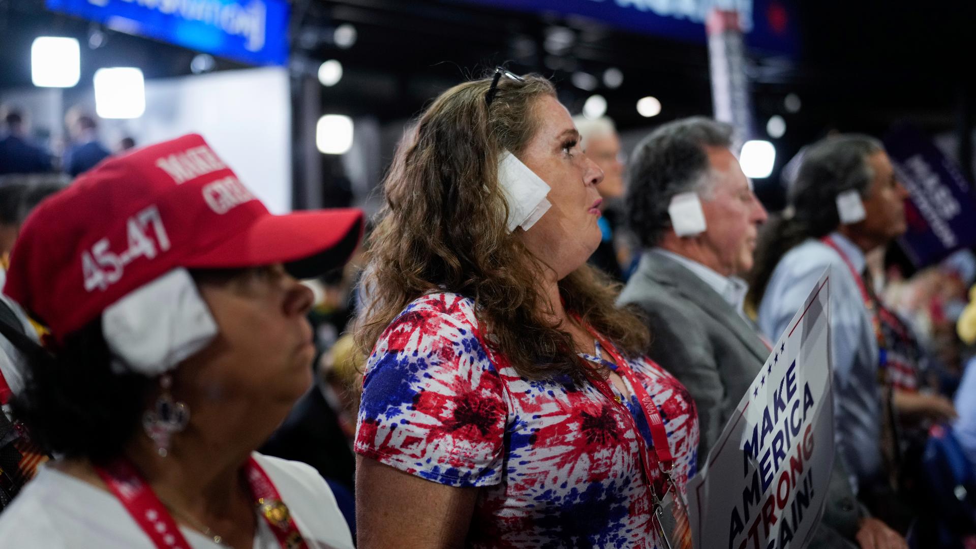 Some Donald Trump supporters are showing their support for the former president by wearing bandages on one of their ears.